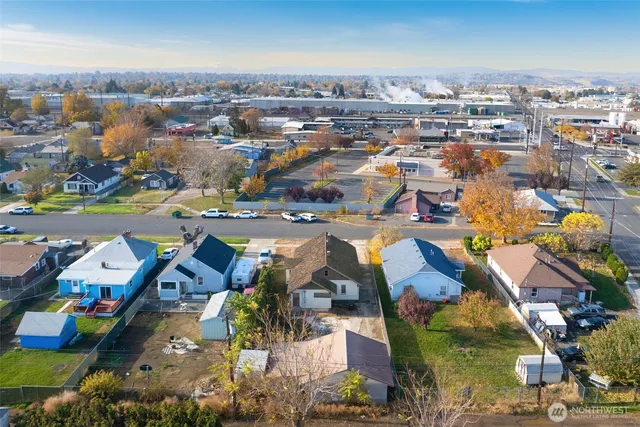 an aerial view of residential houses with outdoor space