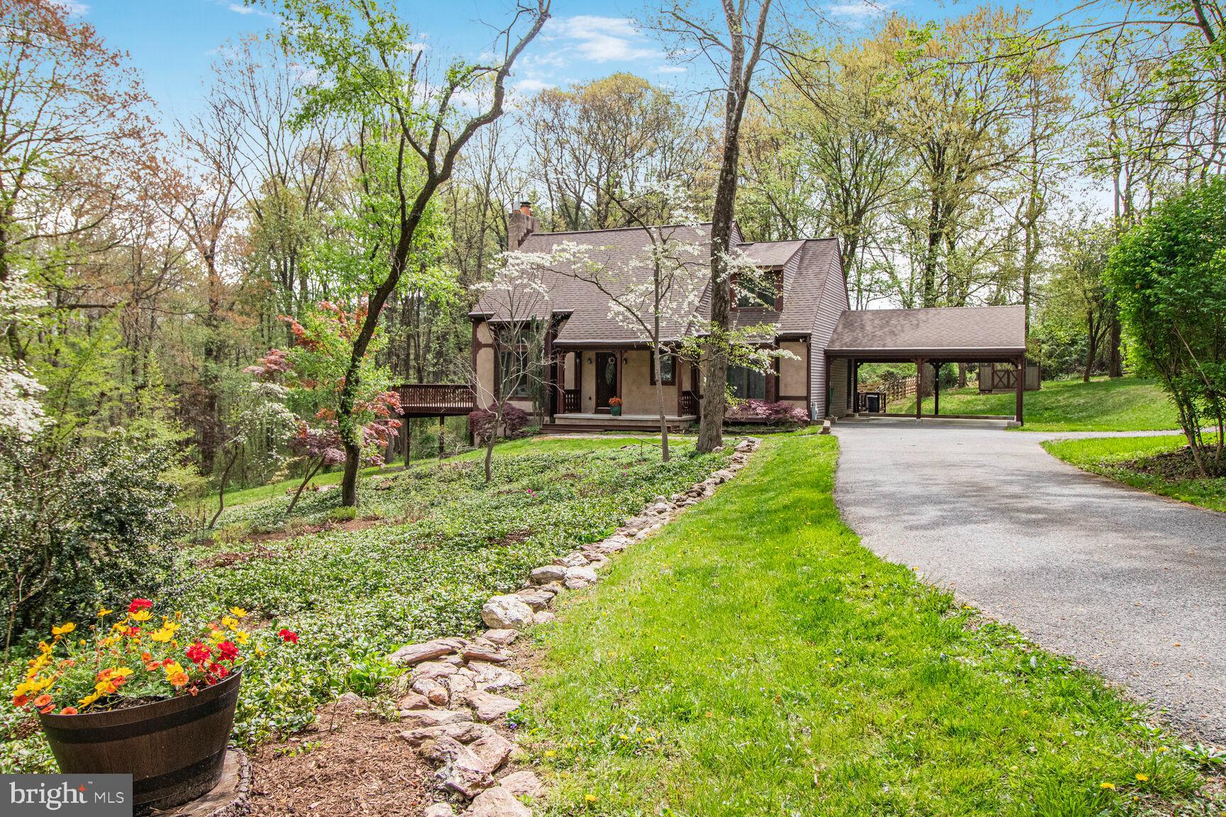 989 Ridge Road Finksburg, MD 21048 - Photo 50 of 50 a front view of a house with a garden and fountain