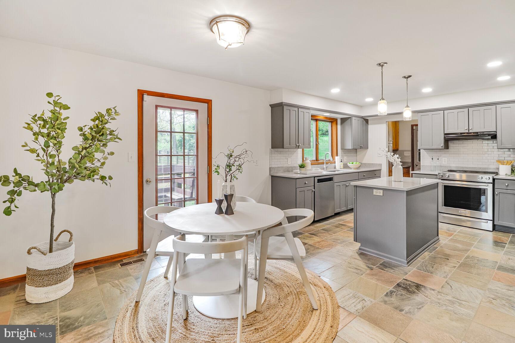 989 Ridge Road Finksburg, MD 21048 - Photo 9 of 50 a kitchen with a table and chairs in it