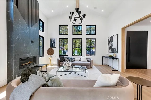 a large kitchen with a table and chairs