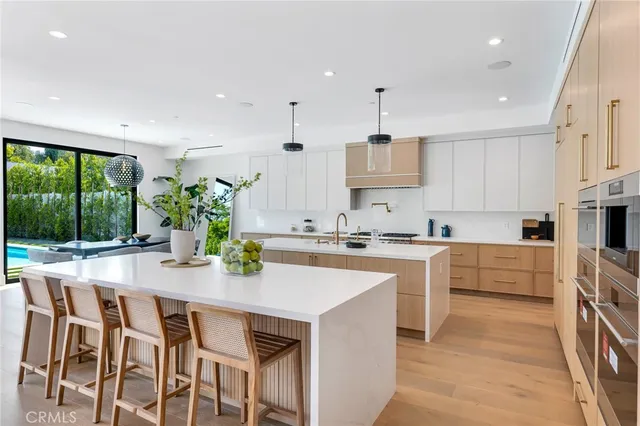 a view of a house with a yard patio and swimming pool