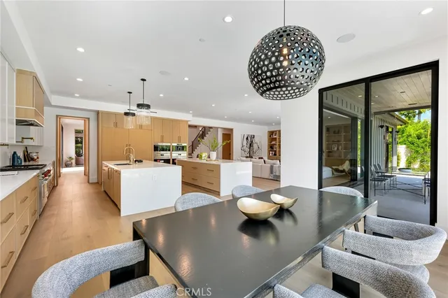 a view of swimming pool with large trees and a big yard with plants