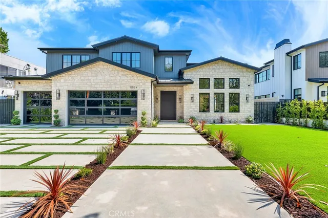 a front view of a house with a yard and porch