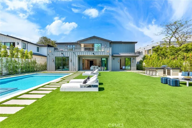 a bedroom with a bed and a chair