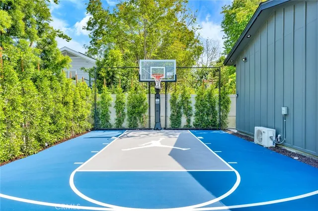 a white bath tub sitting in a bathroom next to a window
