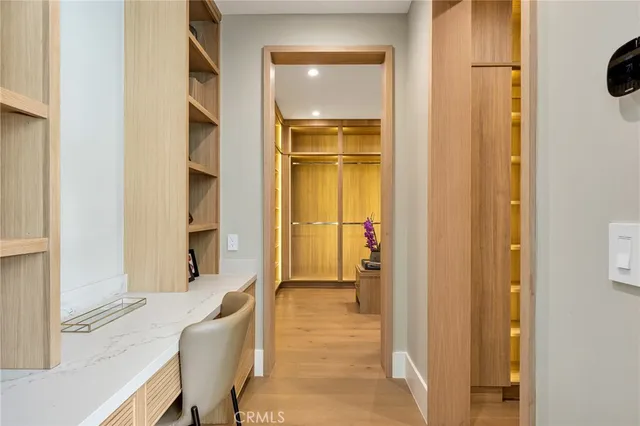 a bathroom with a granite countertop sink a toilet a mirror and shower