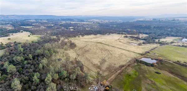 an aerial view of residential house and green space