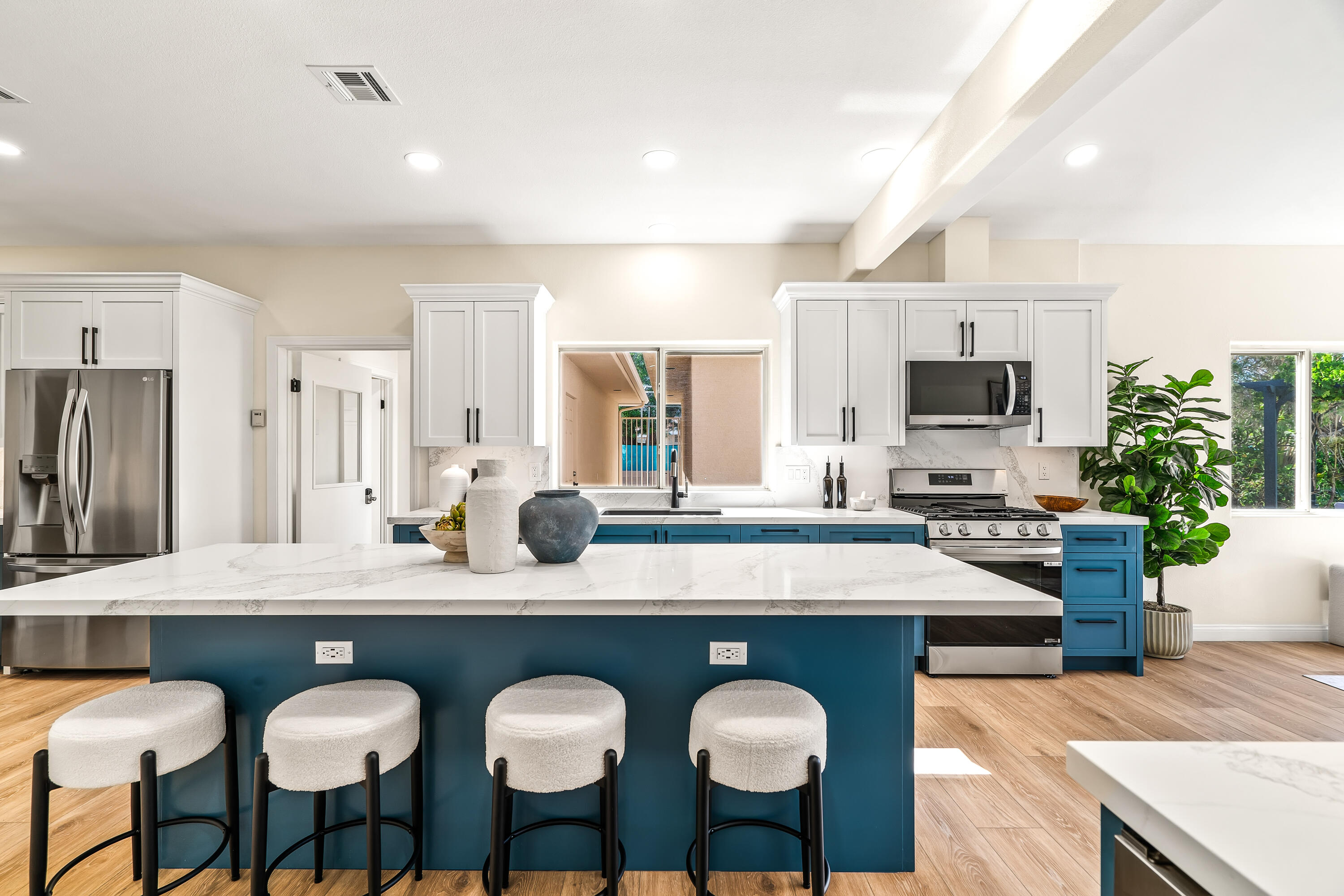 67980 Foothill Road Cathedral City, CA 92234 - Photo 15 of 60 a view of kitchen island dining room appliances wooden floor and living room view
