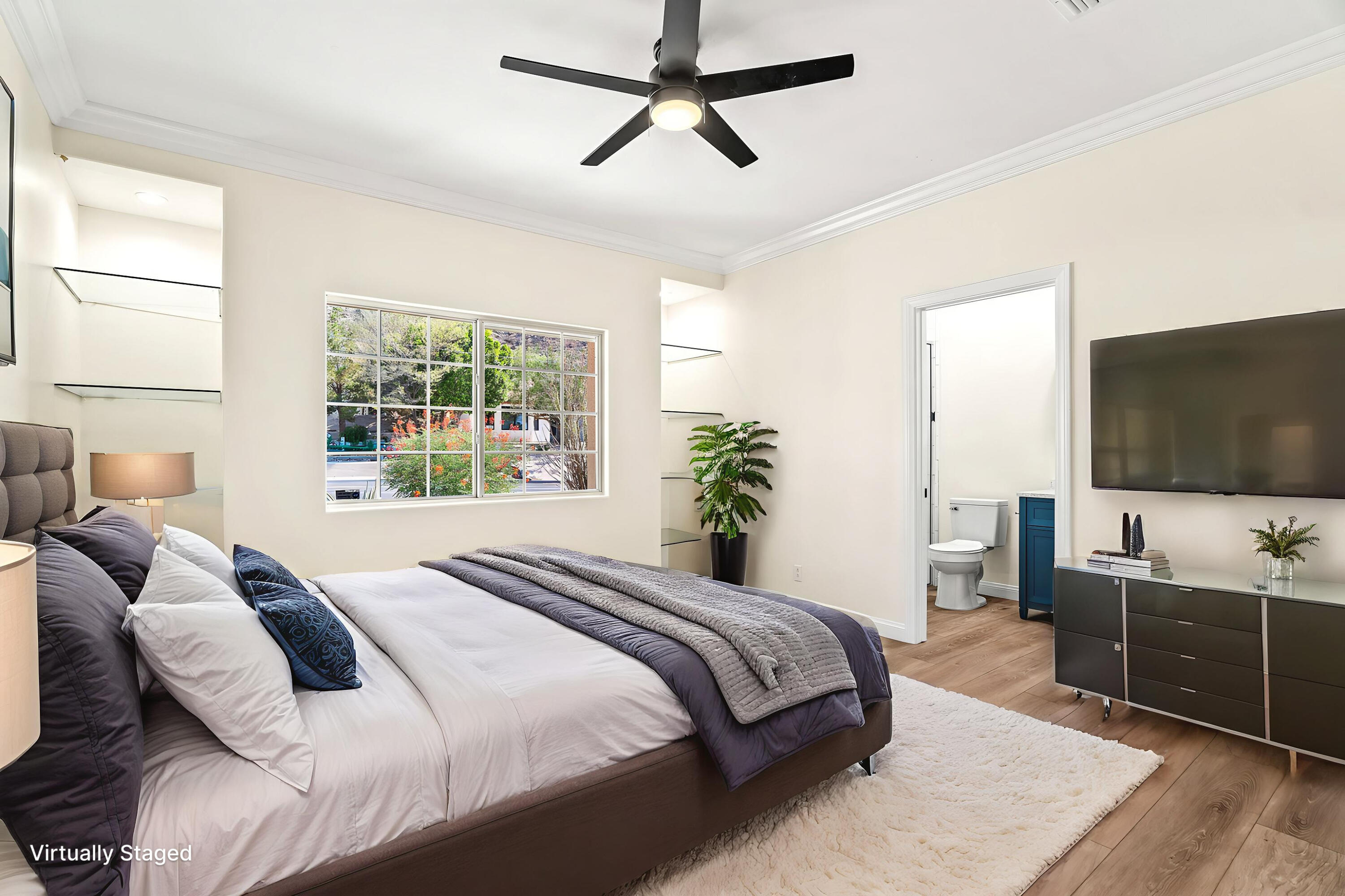 67980 Foothill Road Cathedral City, CA 92234 - Photo 25 of 60 a bedroom with a large bed and a flat screen tv