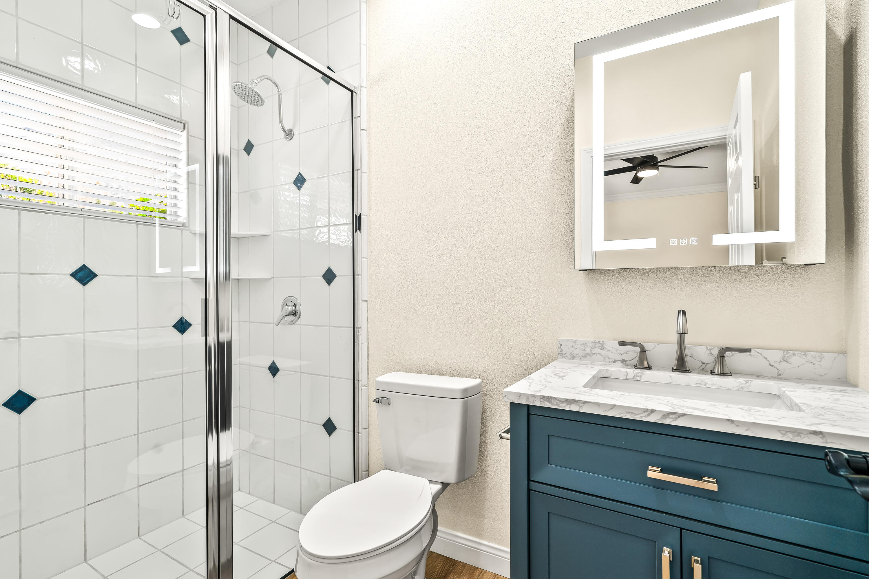 67980 Foothill Road Cathedral City, CA 92234 - Photo 30 of 60 a bathroom with a sink a toilet and shower