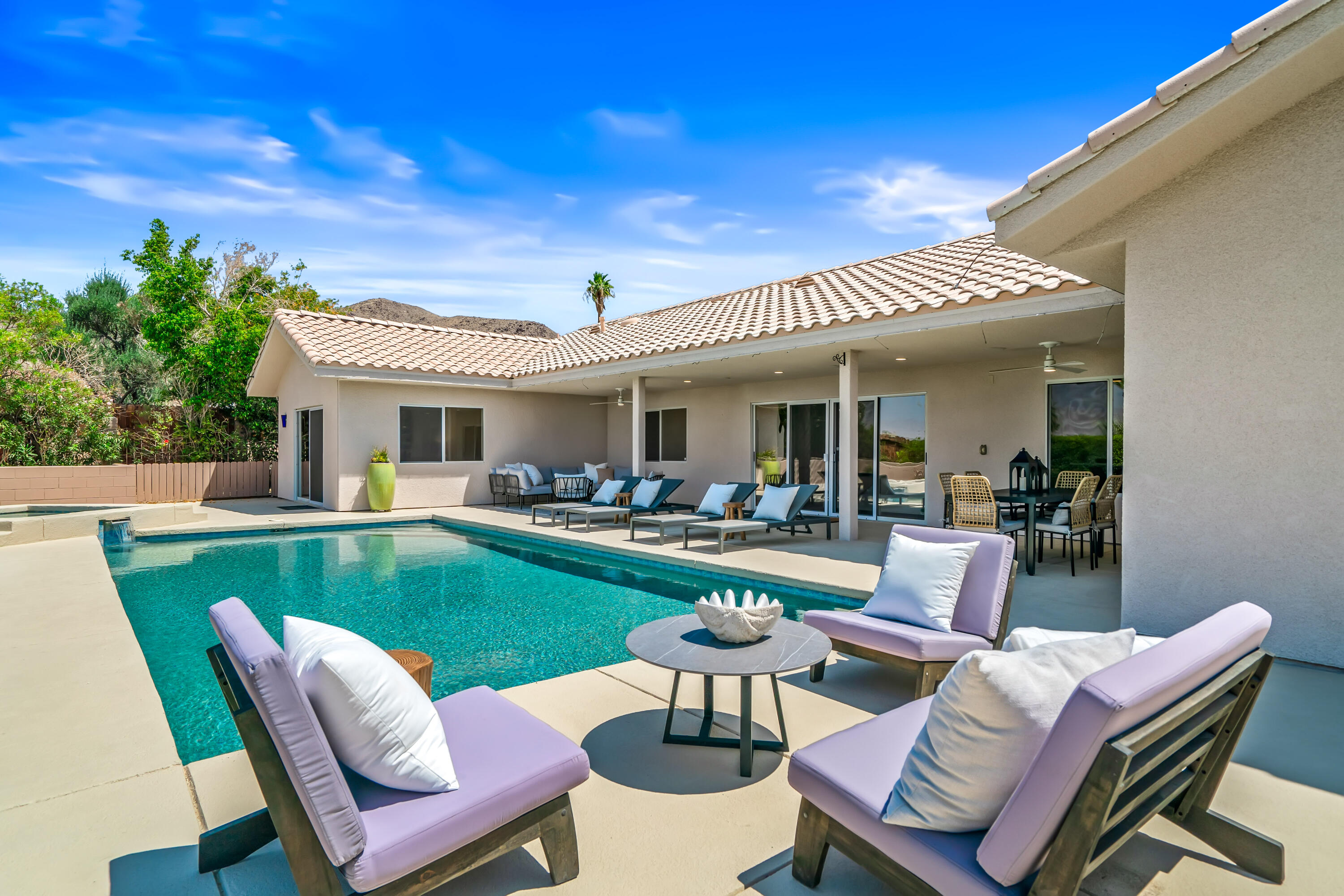 67980 Foothill Road Cathedral City, CA 92234 - Photo 49 of 60 a view of a patio with couches dining table and chairs with wooden floor