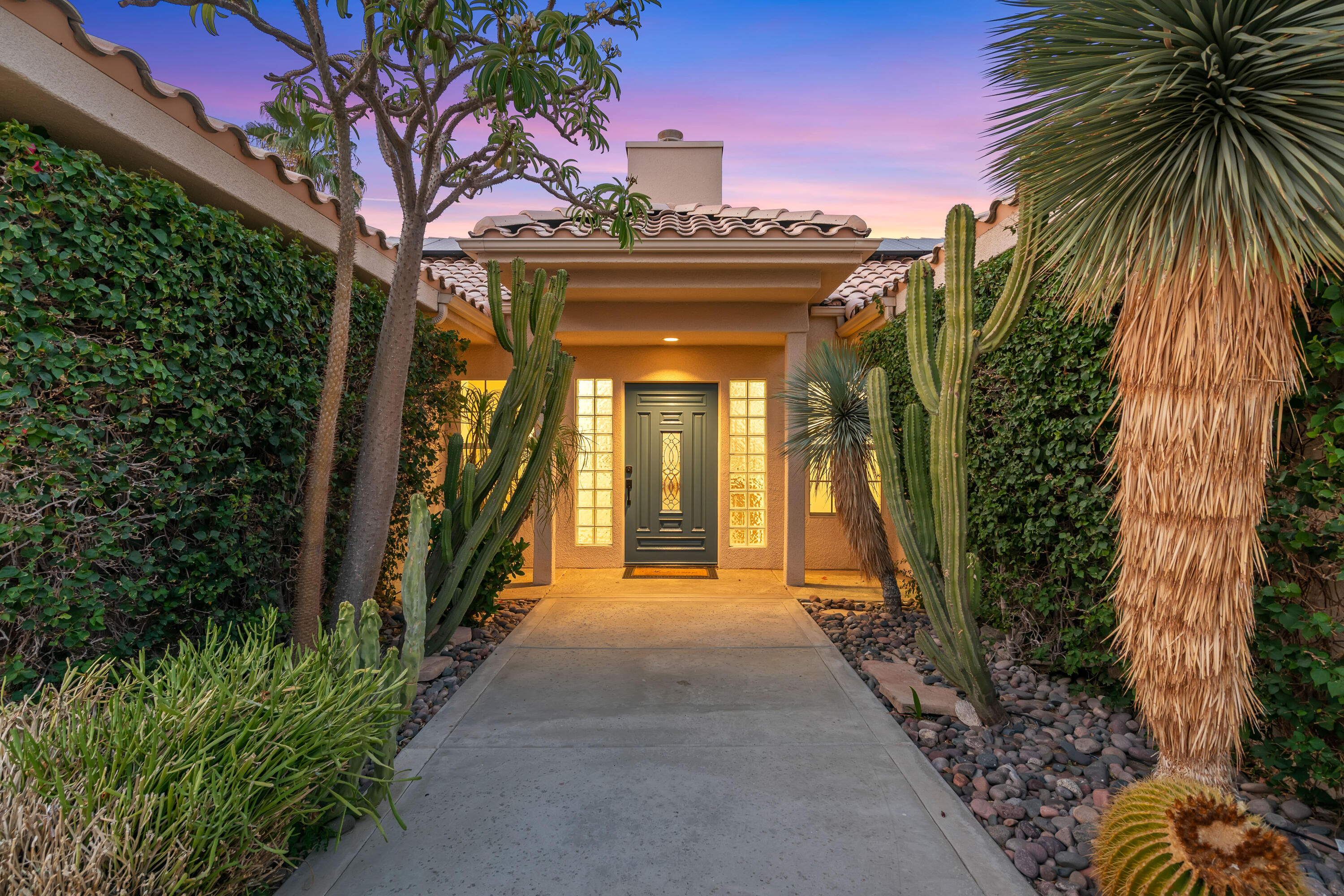 67980 Foothill Road Cathedral City, CA 92234 - Photo 6 of 60 a view of a hallway with flower plants and wooden fence