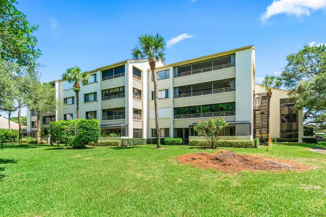 a front view of building with yard