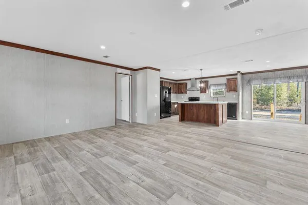 a view of kitchen and wooden floor