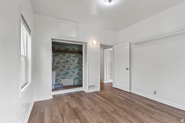 180 South 300 East Logan, UT 84321 - Photo 12 of 35 Unfurnished bedroom featuring vinyl floors and baseboards