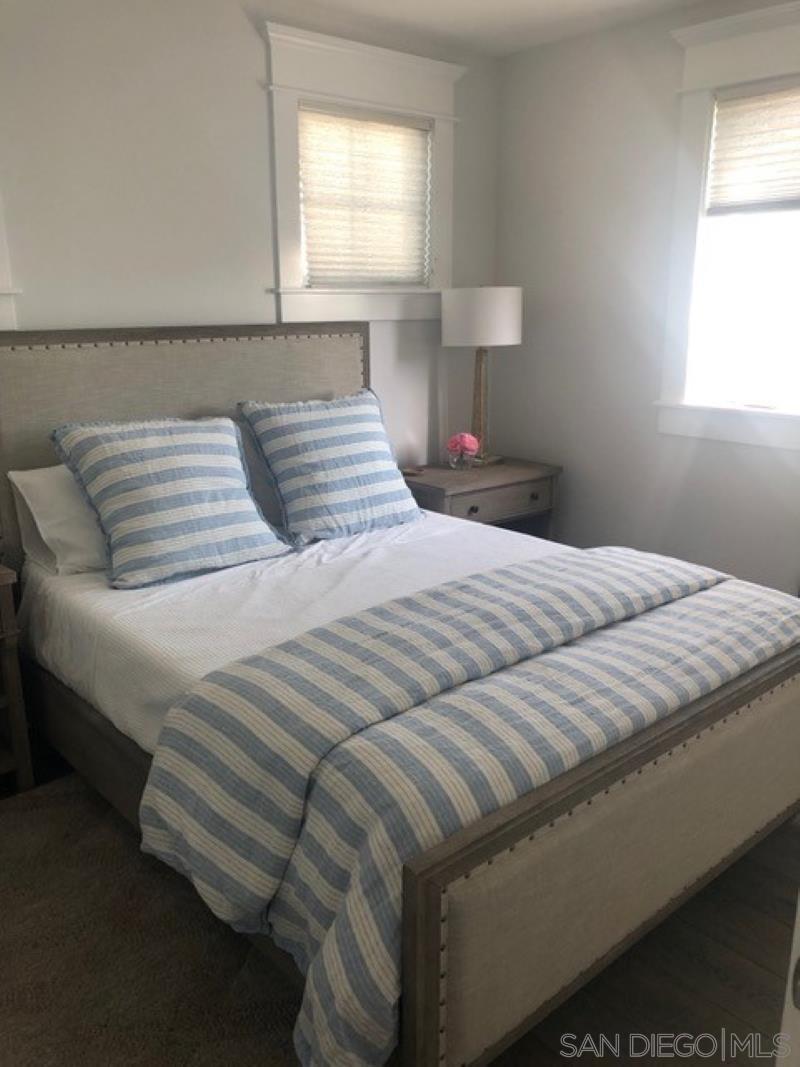 453 E Avenue Coronado, CA 92118 - Photo 15 of 16 a bedroom with a bed and a window