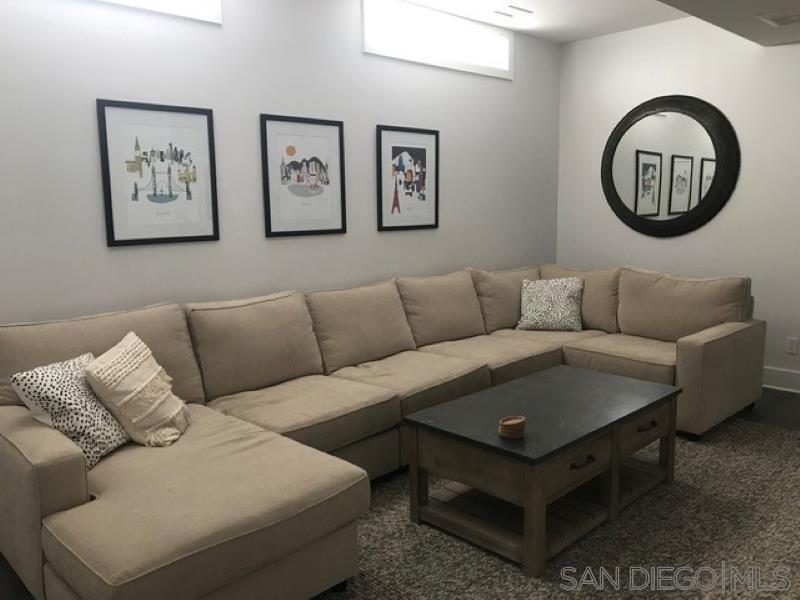 453 E Avenue Coronado, CA 92118 - Photo 7 of 16 a living room with furniture a rug and a large window