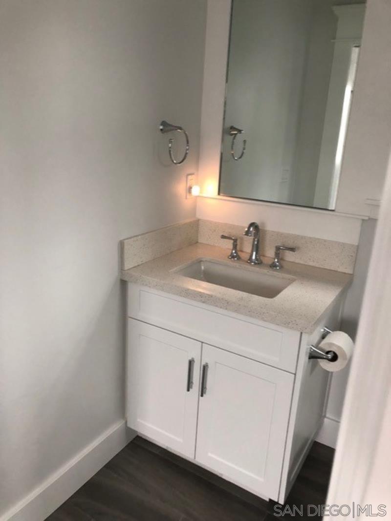 453 E Avenue Coronado, CA 92118 - Photo 8 of 16 a bathroom with a sink and vanity