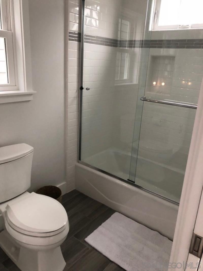 453 E Avenue Coronado, CA 92118 - Photo 9 of 16 a bathroom with a toilet and a shower