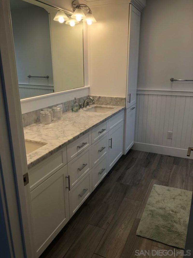 453 E Avenue Coronado, CA 92118 - Photo 10 of 16 a bathroom with a sink and a mirror