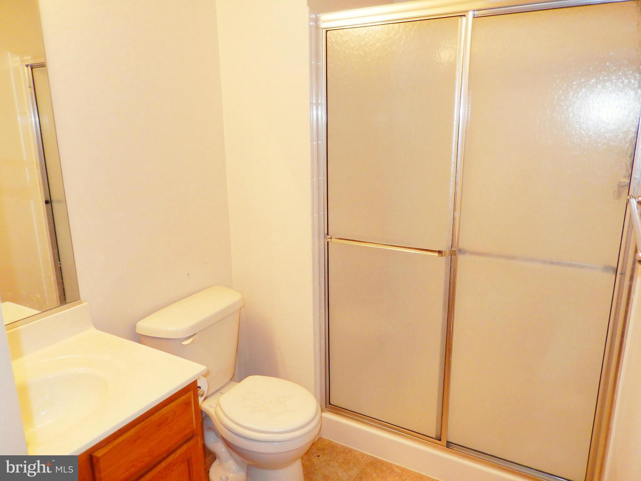 1951 Waltman Road Edgewood, MD 21040 - Photo 20 of 20 a white toilet sitting next to a shower