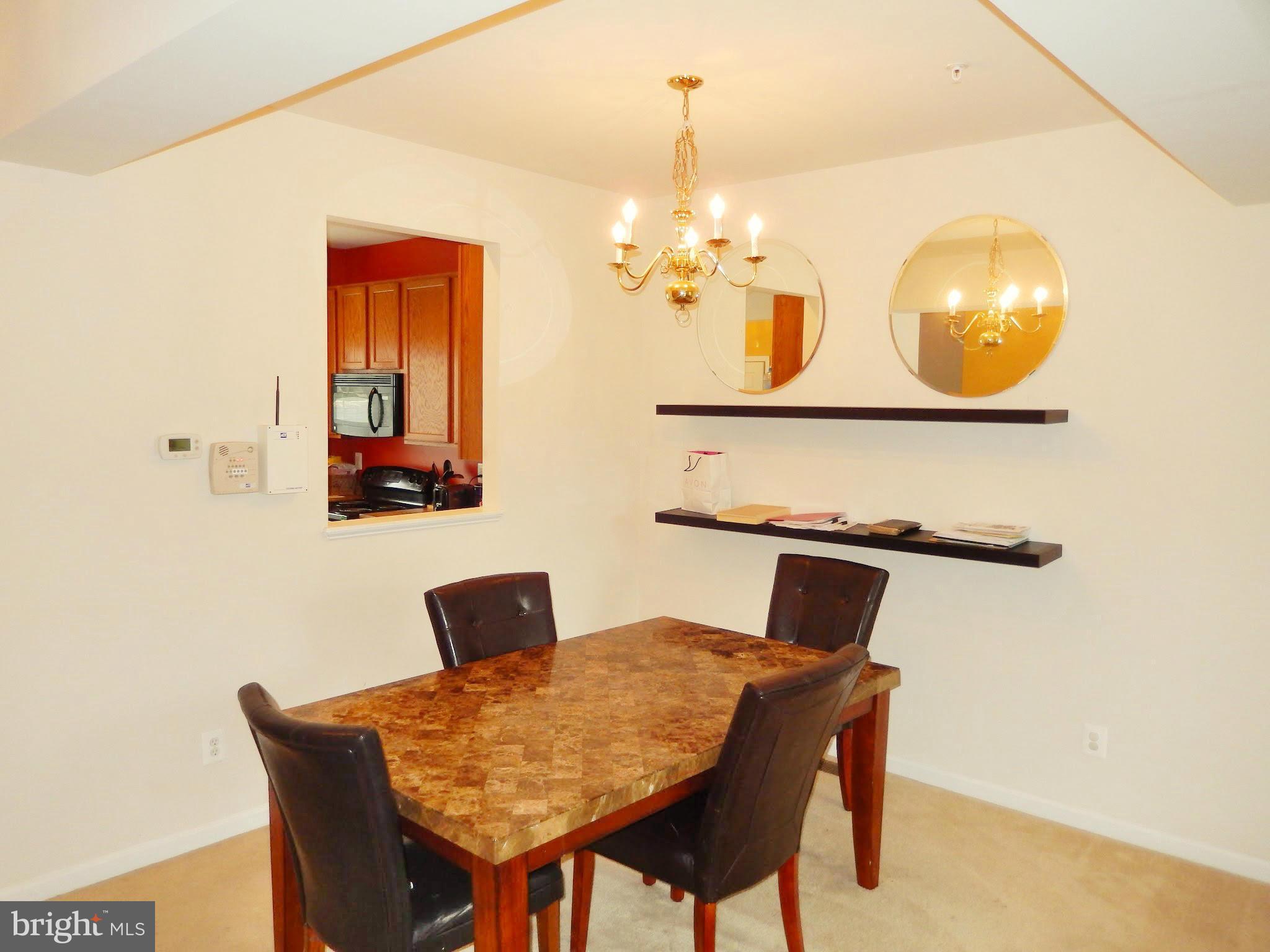 1951 Waltman Road Edgewood, MD 21040 - Photo 7 of 20 a view of a dining room with furniture and chandelier