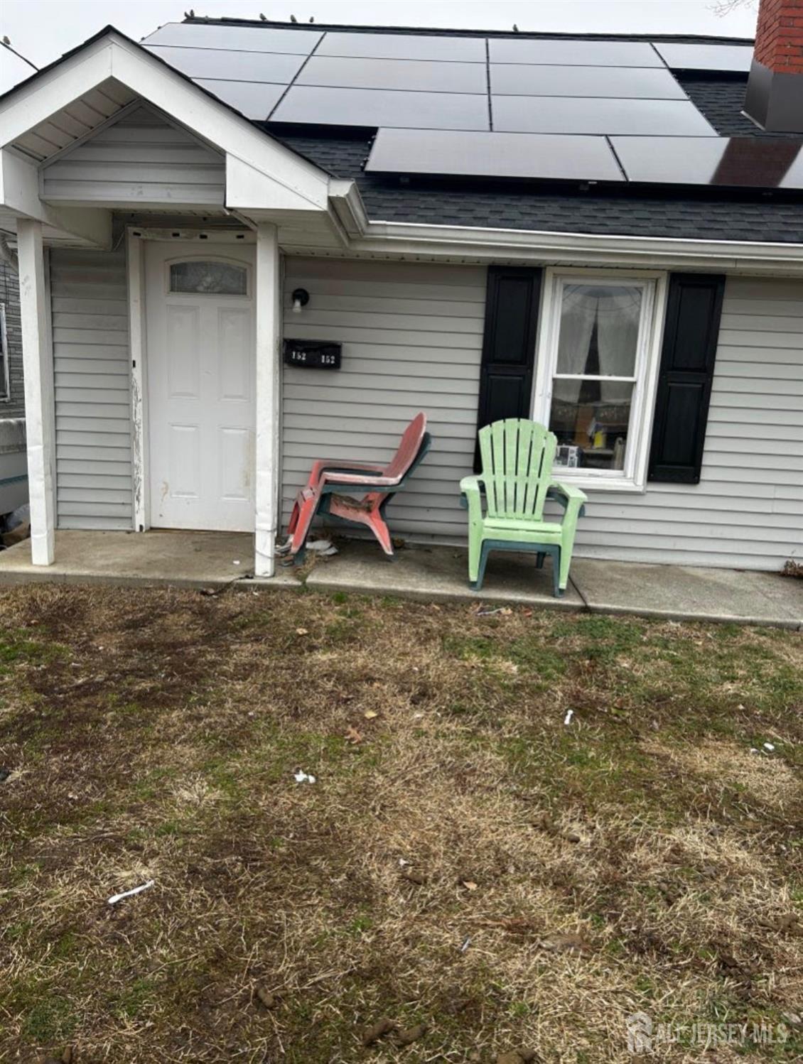 152 Broad Street Carneys Point, NJ 08069 - Photo 1 of 5 a front view of a house with a garden