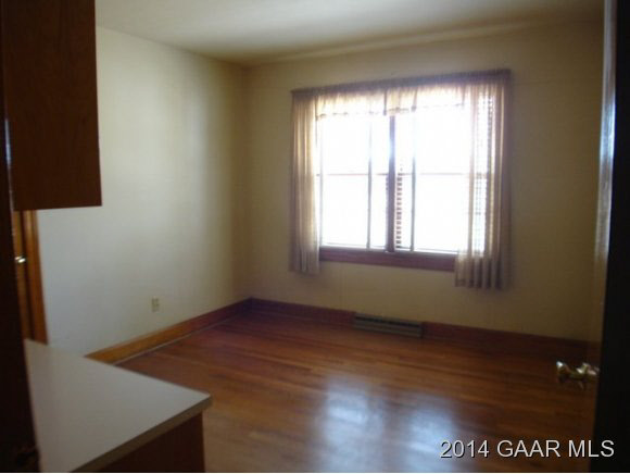 78 Haytie Road Swoope, VA 24479 - Photo 13 of 21 an empty room with wooden floor and windows