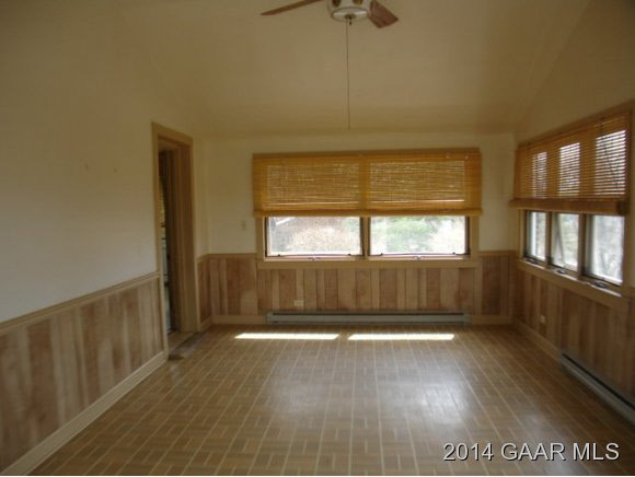 78 Haytie Road Swoope, VA 24479 - Photo 16 of 21 an empty room with wooden floor and windows