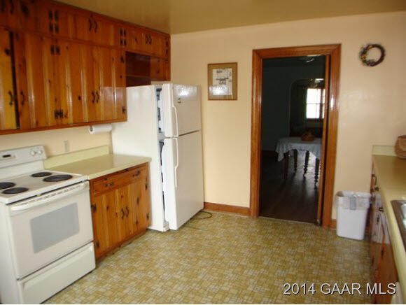 78 Haytie Road Swoope, VA 24479 - Photo 4 of 21 a kitchen with a refrigerator sink stove and cabinets