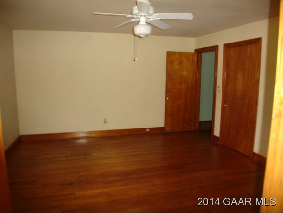 78 Haytie Road Swoope, VA 24479 - Photo 10 of 21 a view of an empty room with window and wooden floor