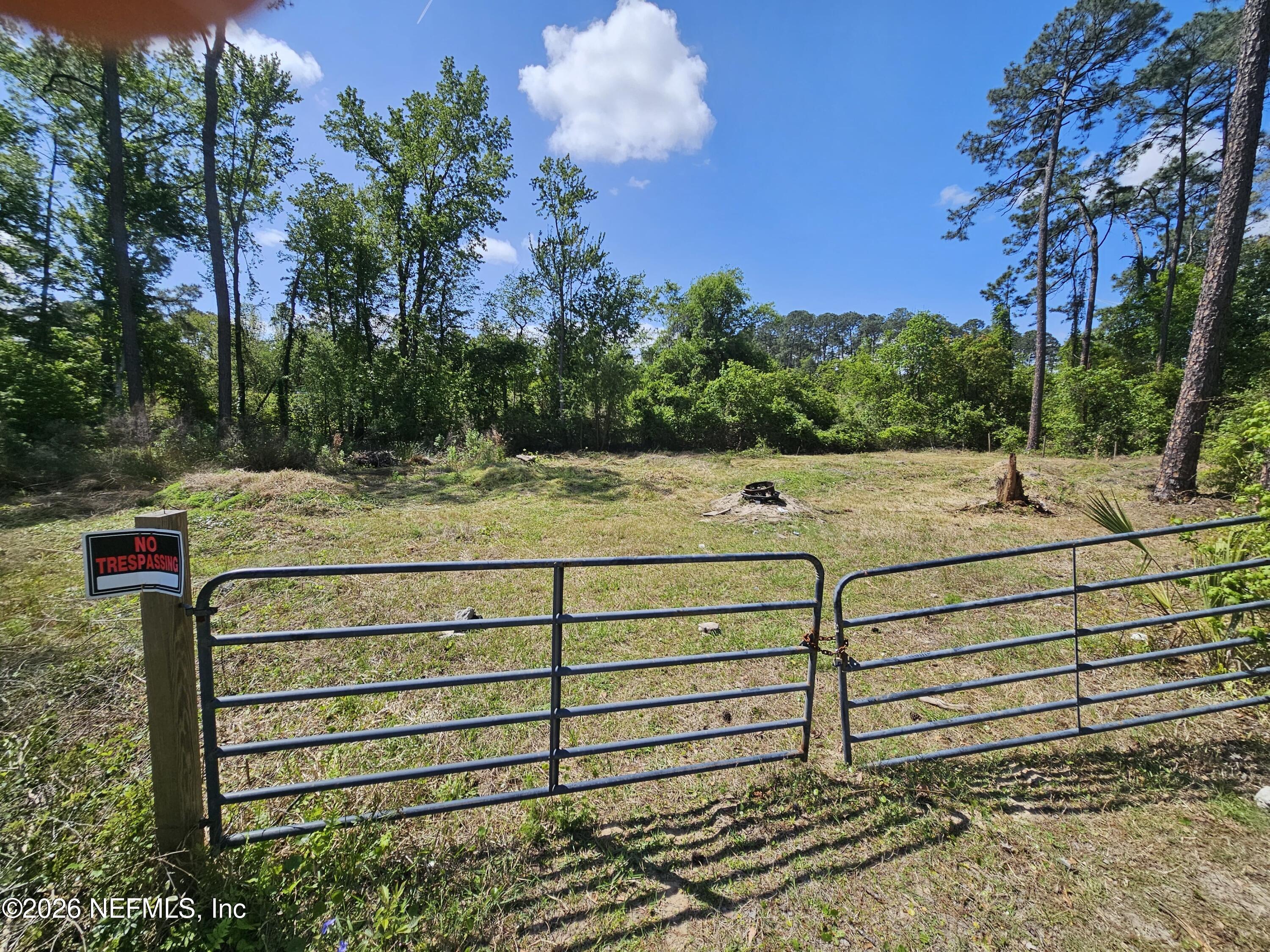 0 Farm Road Jacksonville, FL 32218 - Photo 5 of 5 a view of a bench in the backyard