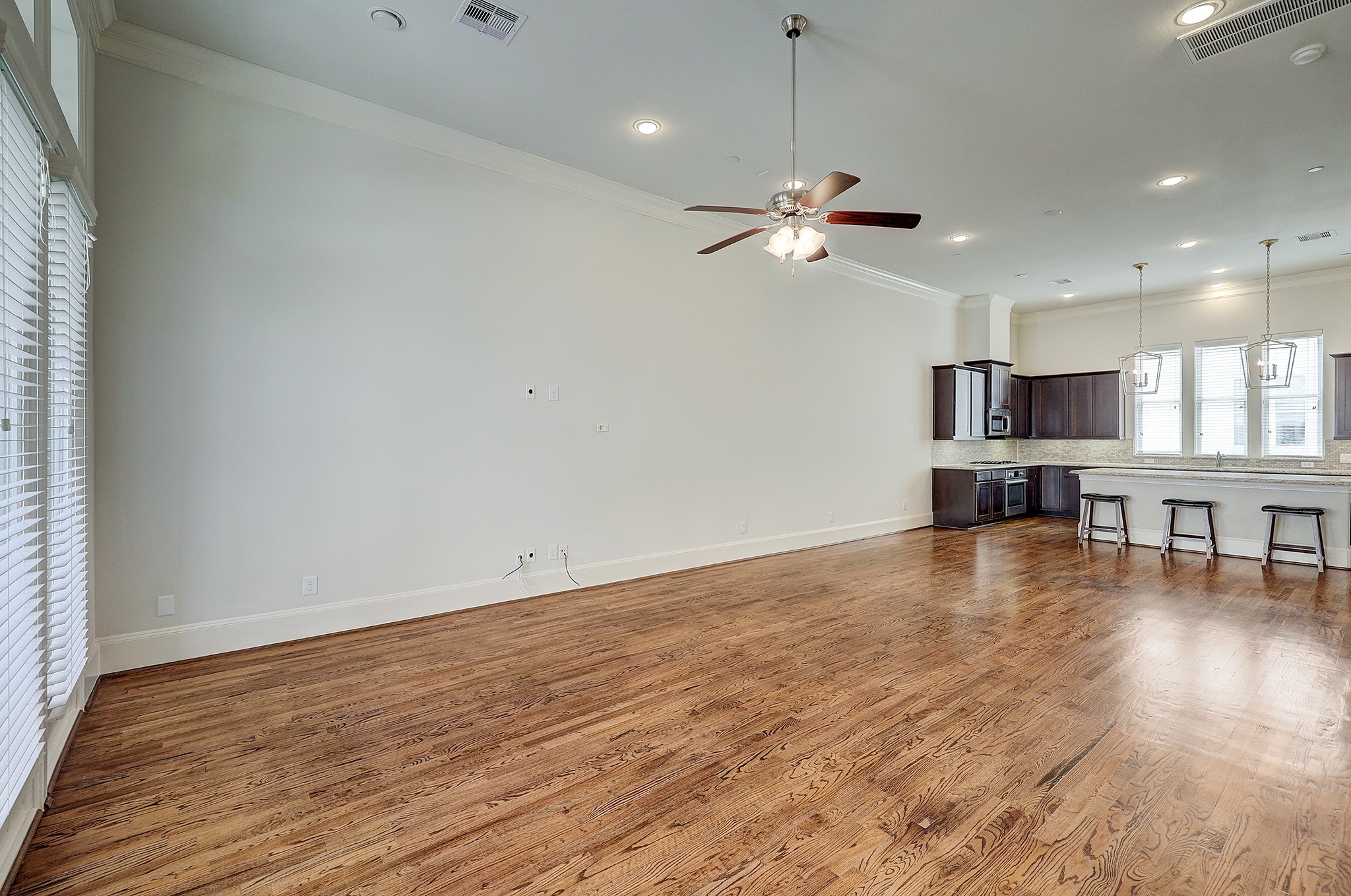 1110 Thompson Street Houston, TX 77007 - Photo 12 of 32 a view of a kitchen with a dishwasher cabinets and wooden floor