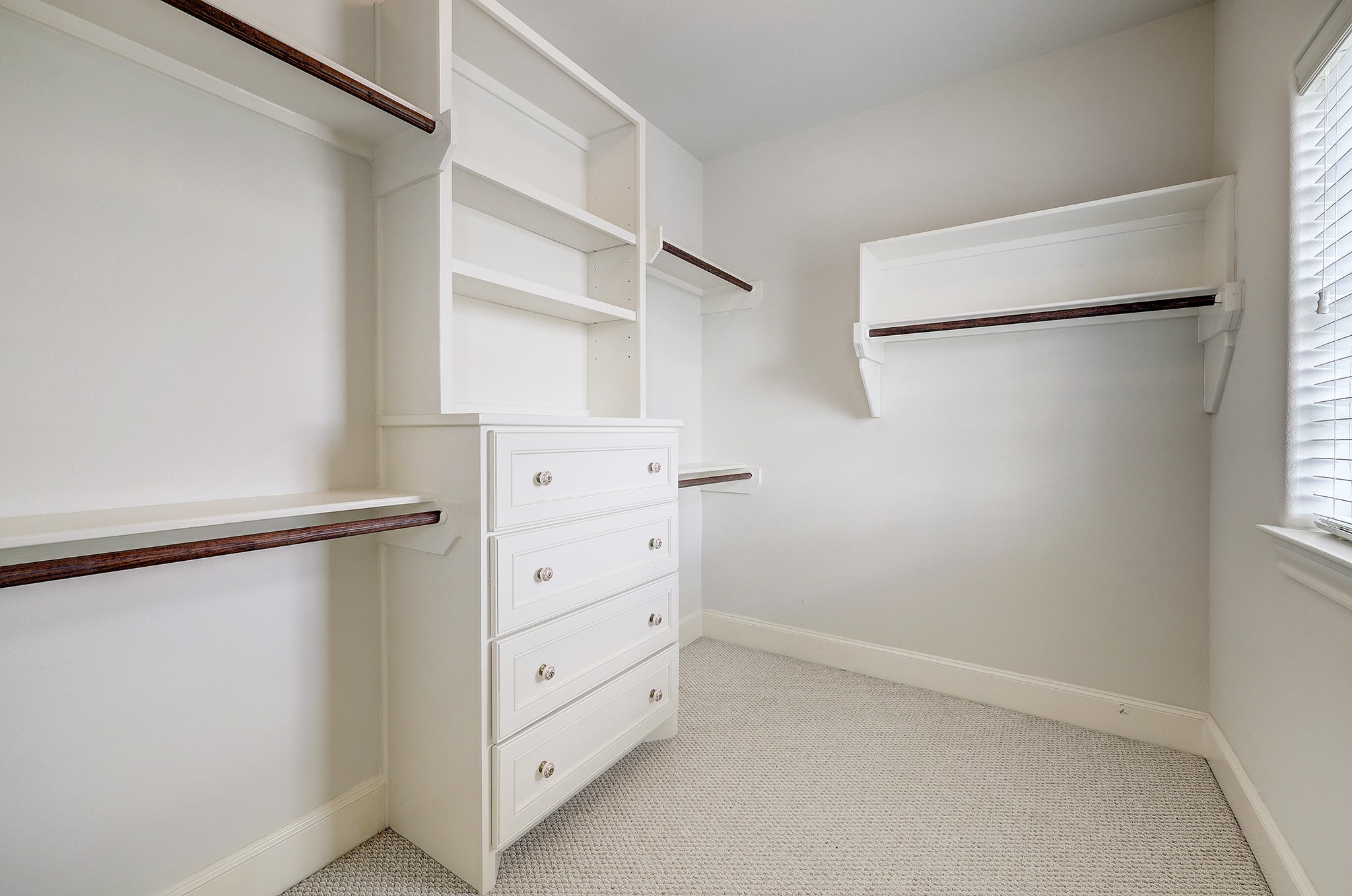 1110 Thompson Street Houston, TX 77007 - Photo 26 of 32 a view of walk in closet with empty racks