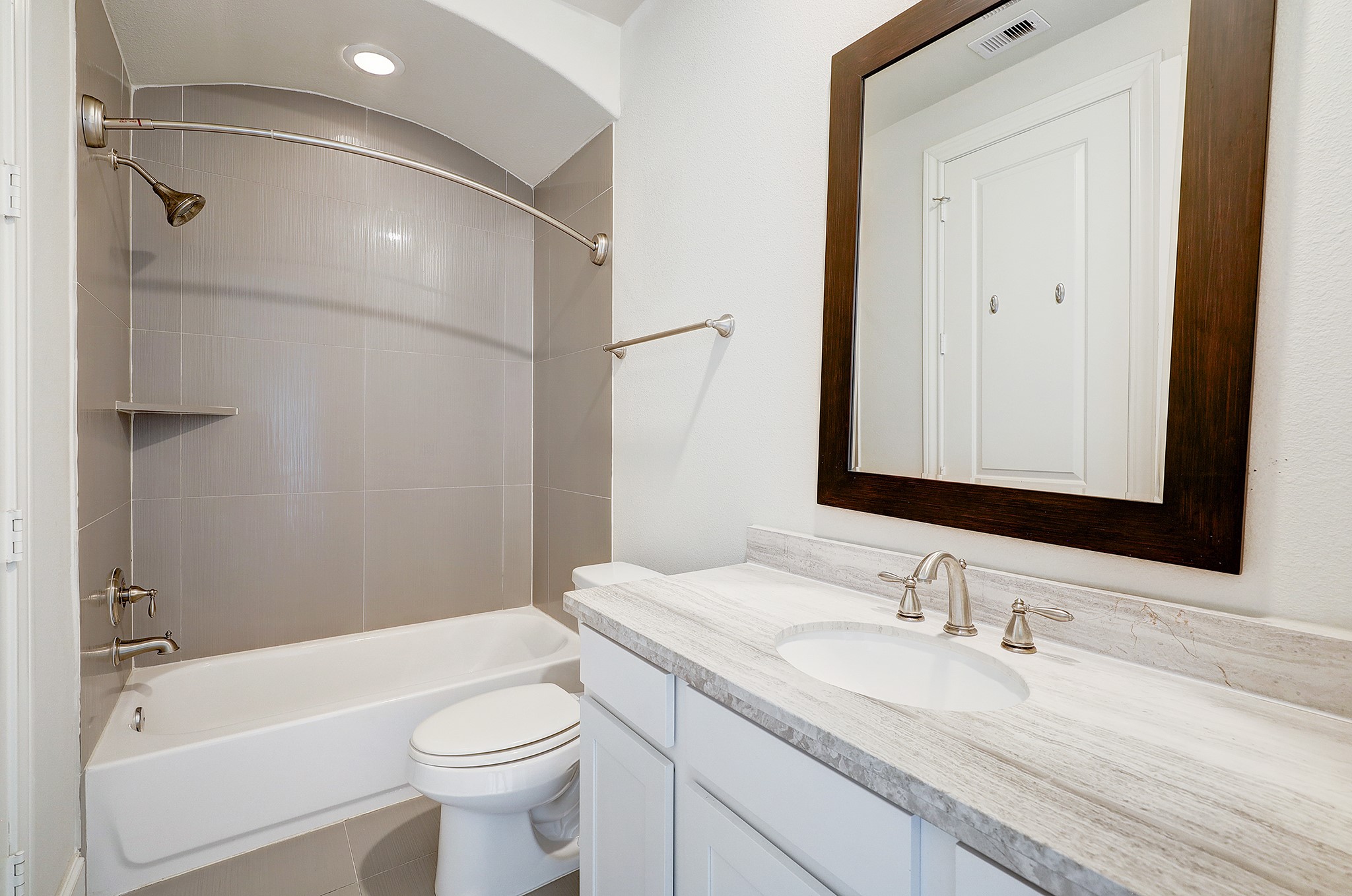 1110 Thompson Street Houston, TX 77007 - Photo 27 of 32 a bathroom with a granite countertop sink toilet and shower