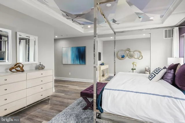 a bedroom with a bed and a dresser