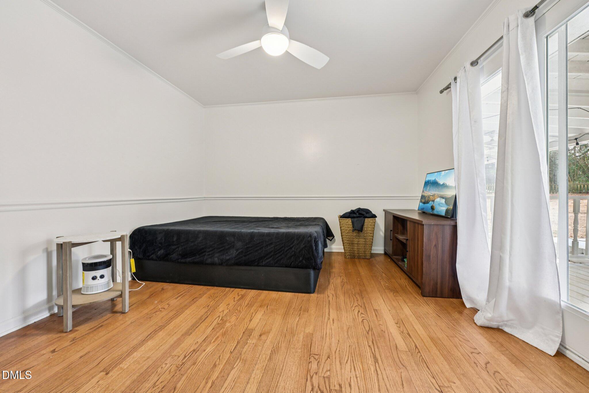 131 Creech Road Garner, NC 27529 - Photo 11 of 18 a bedroom with a bed and a window