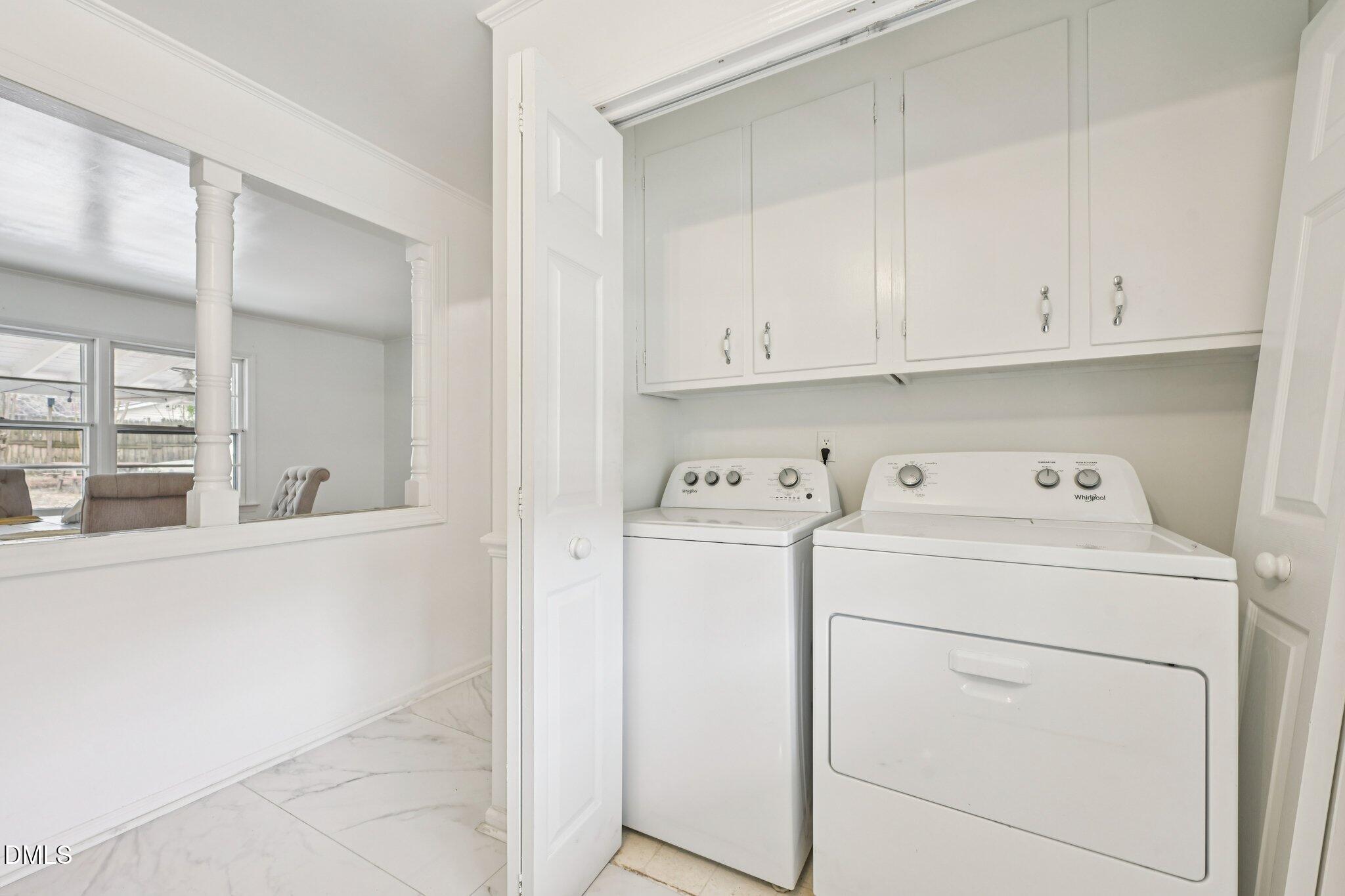 131 Creech Road Garner, NC 27529 - Photo 13 of 18 a view of storage and utility room with washer and dryer