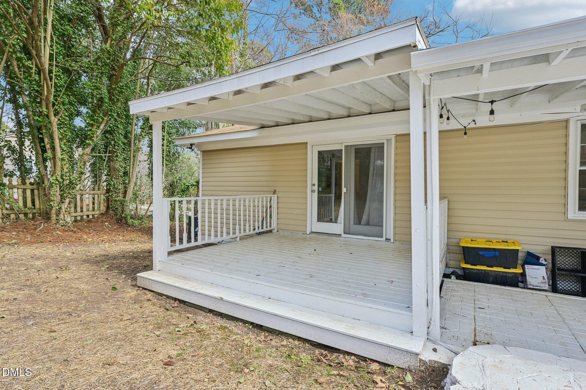 131 Creech Road Garner, NC 27529 - Photo 16 of 18 a view of a house with a wooden fence