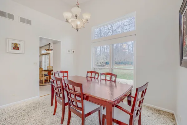 a view of a dining room with furniture window and outside view