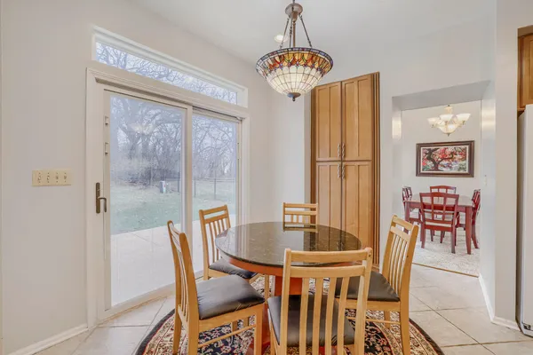 a dining room with furniture and window