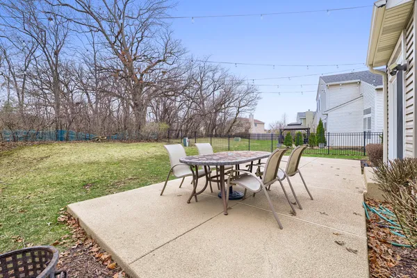 a view of a backyard with sitting area