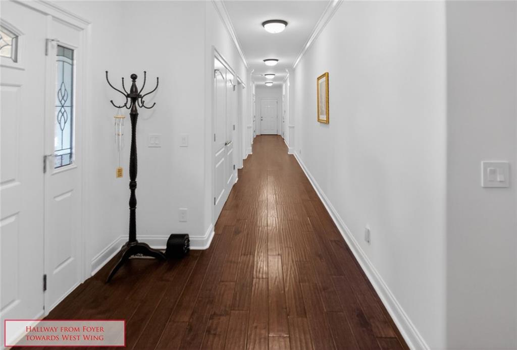 4113 Ledan Extension Gainesville, GA 30506 - Photo 39 of 195 a view of a hallway with wooden floor and staircase