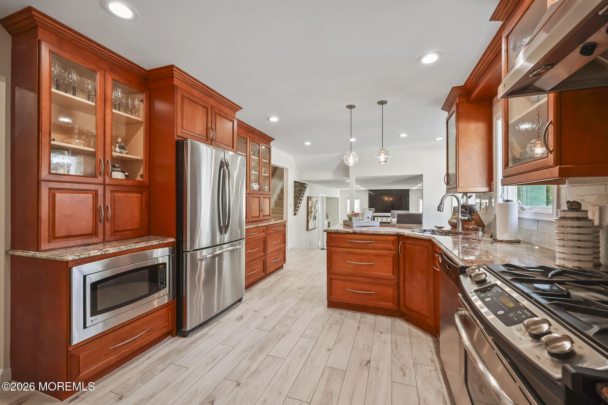 20 Colts Run Marlboro, NJ 07746 - Photo 17 of 44 a kitchen with stainless steel appliances granite countertop a stove top oven a sink and a refrigerator