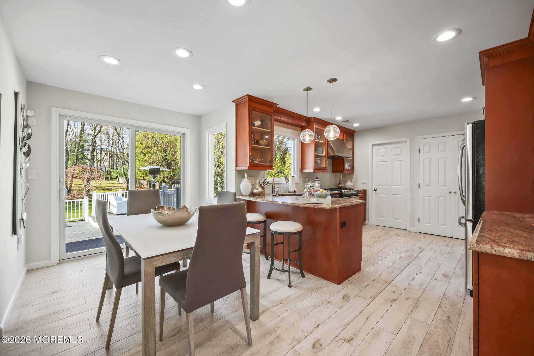 20 Colts Run Marlboro, NJ 07746 - Photo 18 of 44 a room with stainless steel appliances kitchen island granite countertop furniture and a wooden floor