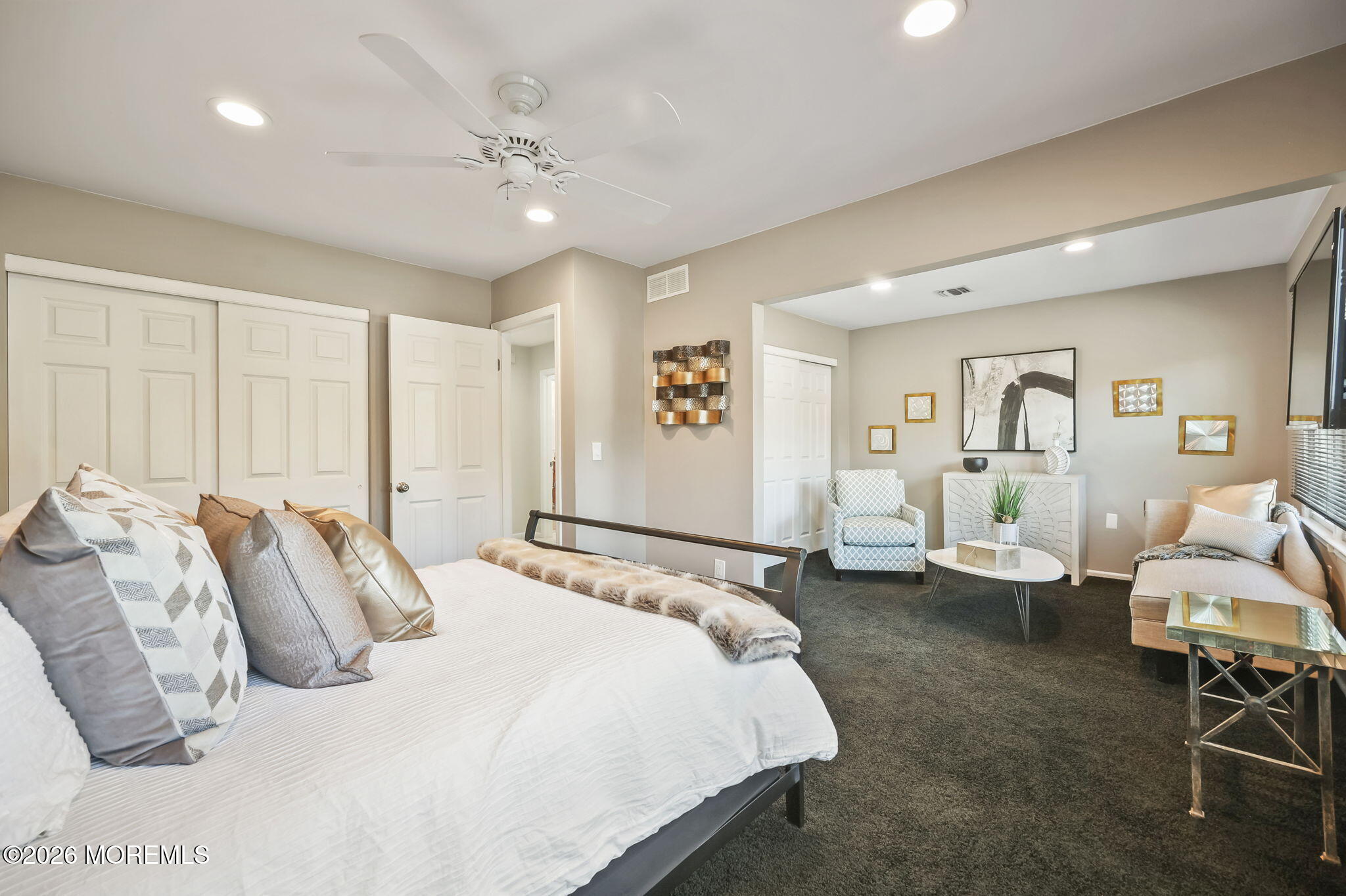 20 Colts Run Marlboro, NJ 07746 - Photo 30 of 44 a bedroom with a large bed and a chandelier