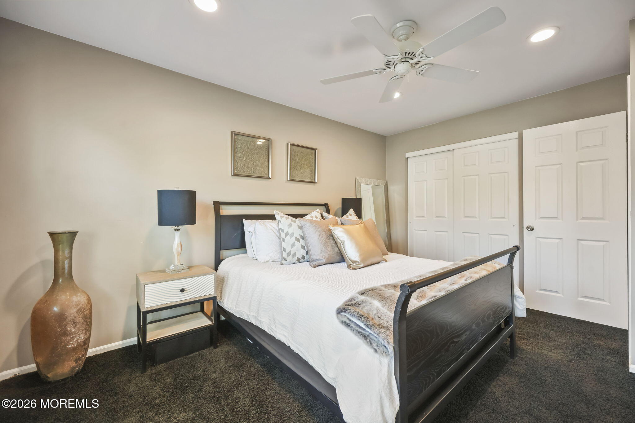 20 Colts Run Marlboro, NJ 07746 - Photo 31 of 44 a bedroom with a bed and a chandelier