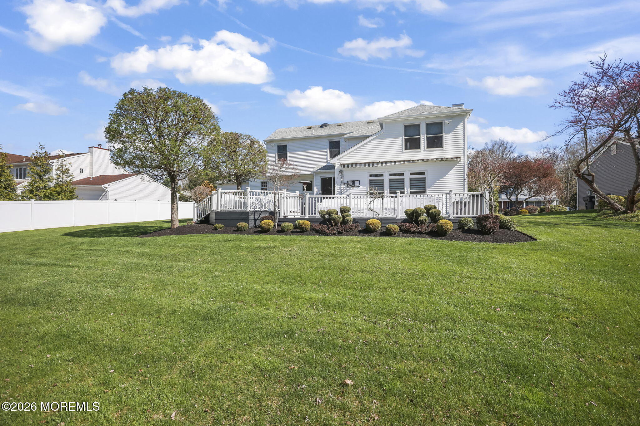 20 Colts Run Marlboro, NJ 07746 - Photo 38 of 44 a front view of a house with a garden and trees