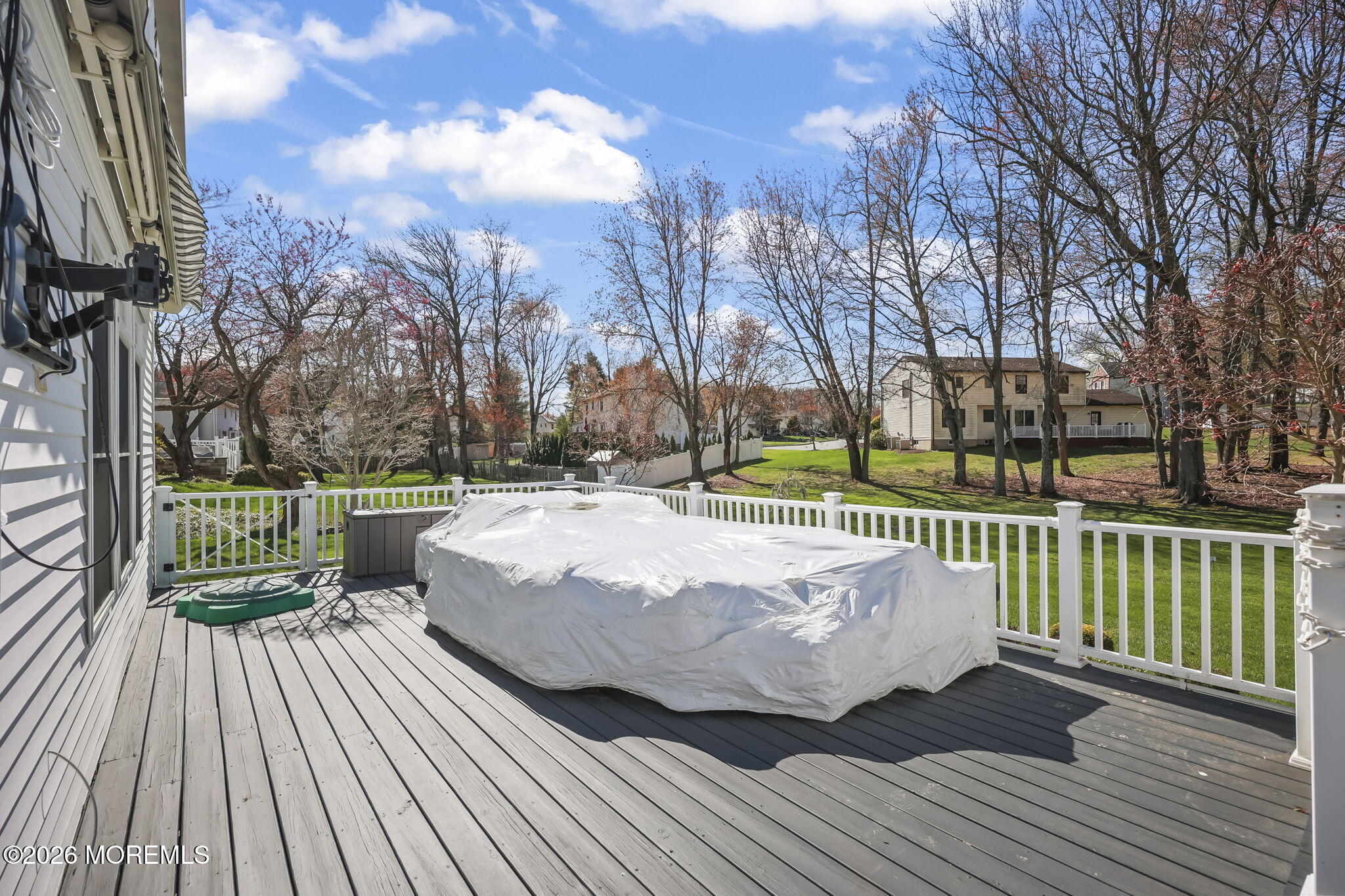 20 Colts Run Marlboro, NJ 07746 - Photo 40 of 44 a view of a deck with wooden floor and fence with a bench