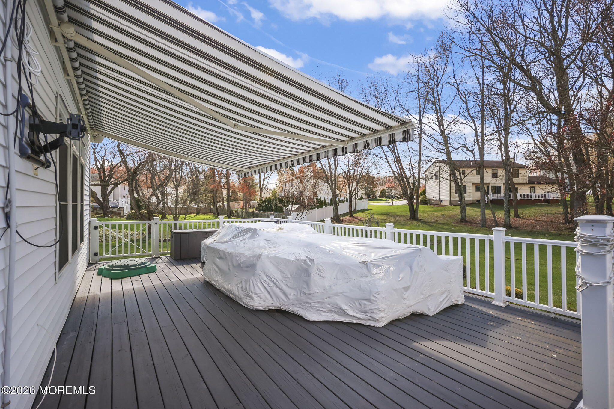 20 Colts Run Marlboro, NJ 07746 - Photo 41 of 44 a view of a wooden deck with a yard